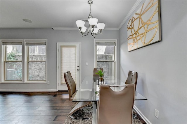 3351 Vintage Cir SE, Smyrna, GA 30080 - dining space featuring a chandelier, wood-type flooring, ornamental molding, and baseboards