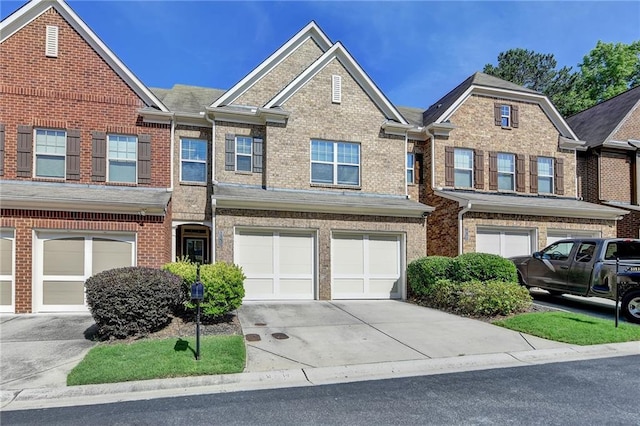 3351 Vintage Cir SE, Smyrna, GA 30080 - townhome / multi-family property featuring concrete driveway, an attached garage, and brick siding