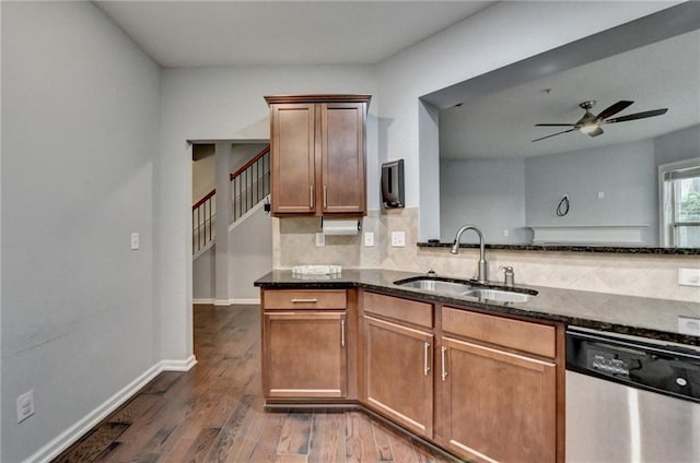 3351 Vintage Cir SE, Smyrna, GA 30080 - kitchen with a sink, stainless steel dishwasher, dark stone countertops, a ceiling fan, and decorative backsplash