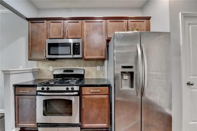 3351 Vintage Cir SE, Smyrna, GA 30080 - kitchen featuring appliances with stainless steel finishes, decorative backsplash, and dark stone countertops