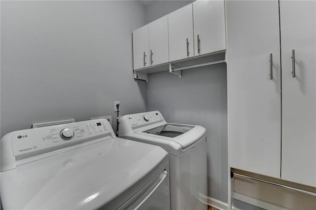 3351 Vintage Cir SE, Smyrna, GA 30080 - laundry room featuring cabinet space and washing machine and dryer