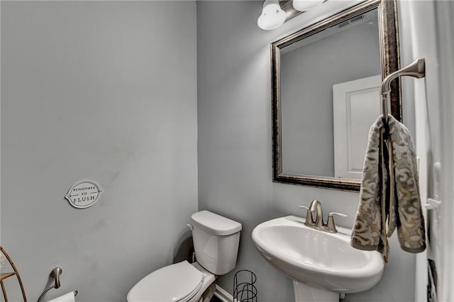 3351 Vintage Cir SE, Smyrna, GA 30080 - bathroom with a sink, toilet, and baseboards