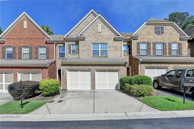 3351 Vintage Cir SE, Smyrna, GA 30080 - view of property featuring driveway, a garage, and brick siding