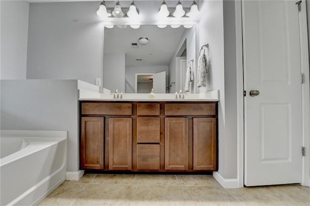 3351 Vintage Cir SE, Smyrna, GA 30080 - bathroom with a garden tub, double vanity, baseboards, and tile patterned flooring
