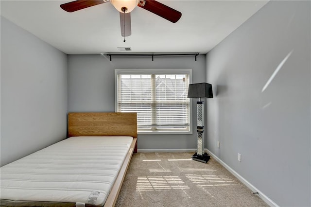 3351 Vintage Cir SE, Smyrna, GA 30080 - carpeted bedroom with baseboards and ceiling fan