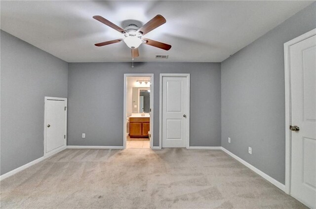 3351 Vintage Cir SE, Smyrna, GA 30080 - unfurnished bedroom featuring light colored carpet, baseboards, ensuite bathroom, and ceiling fan