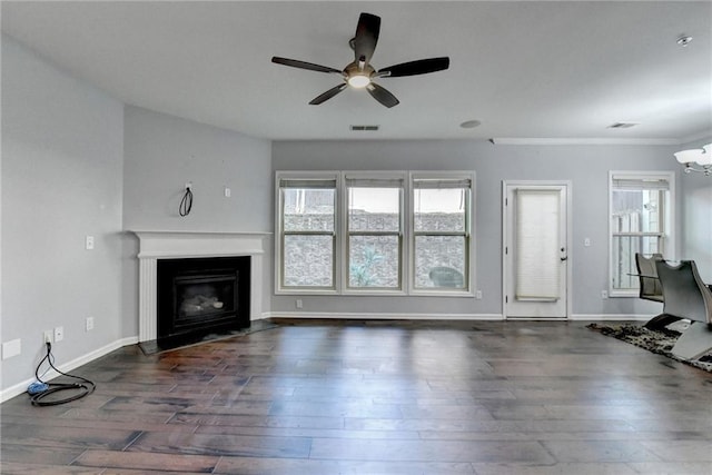 3351 Vintage Cir SE, Smyrna, GA 30080 - unfurnished living room featuring a ceiling fan, wood finished floors, a glass covered fireplace, baseboards, and ornamental molding