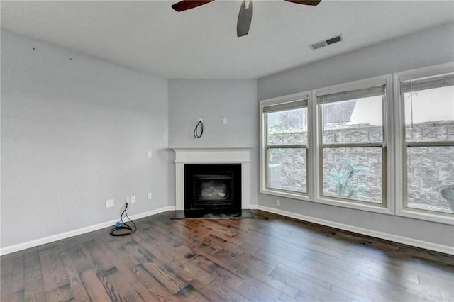 3351 Vintage Cir SE, Smyrna, GA 30080 - unfurnished living room featuring ceiling fan, dark wood-style flooring, baseboards, and a fireplace with flush hearth