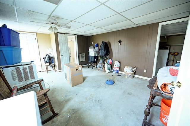 interior space with ceiling fan