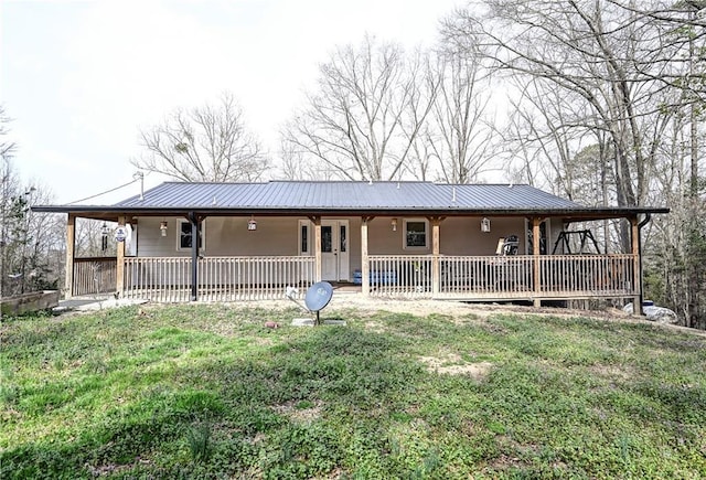 farmhouse-style home with a porch and metal roof