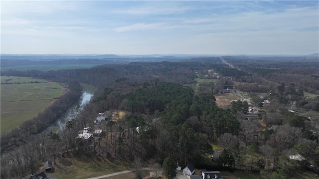 bird's eye view featuring a rural view and a forest view