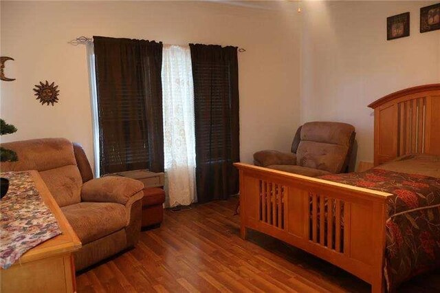 bedroom with wood finished floors
