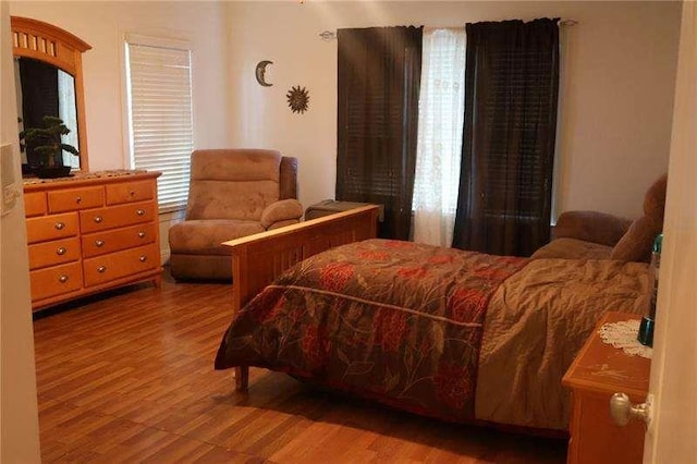 bedroom with wood finished floors