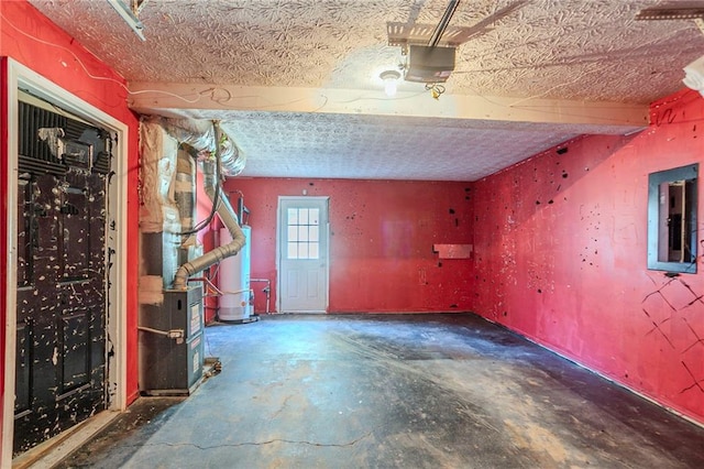 below grade area featuring water heater, a garage, electric panel, and a textured ceiling