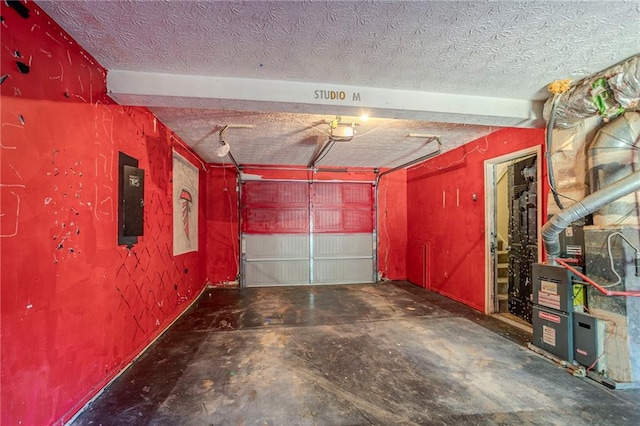 garage with a garage door opener and electric panel