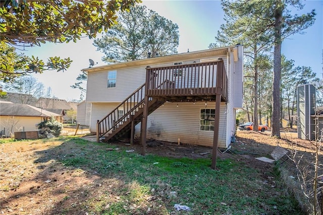 back of house with stairway and a deck