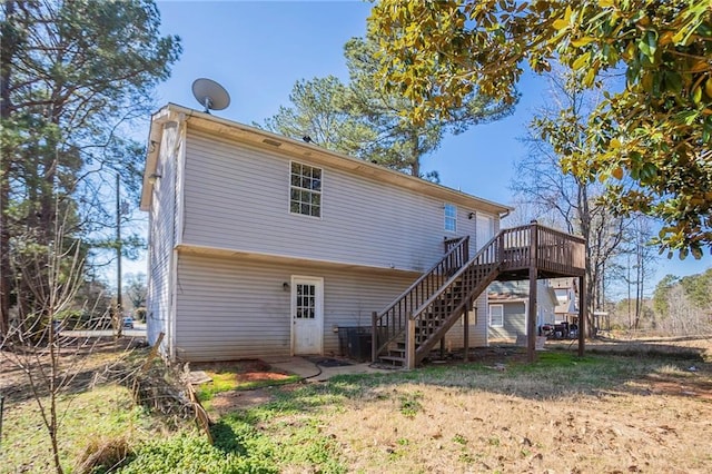 back of house with a deck and stairway