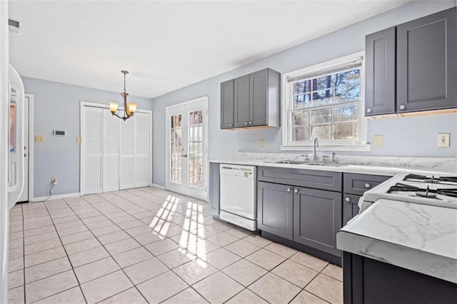 kitchen with white appliances, sink, light tile patterned floors, pendant lighting, and gray cabinets