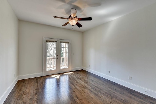 empty room with baseboards, dark wood-type flooring, and french doors