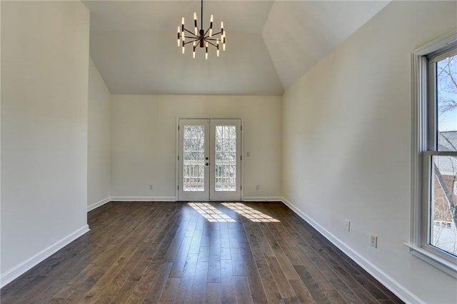 foyer entrance with french doors, dark wood finished floors, and baseboards