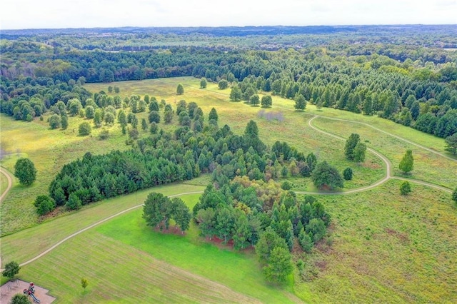 bird's eye view featuring a forest view