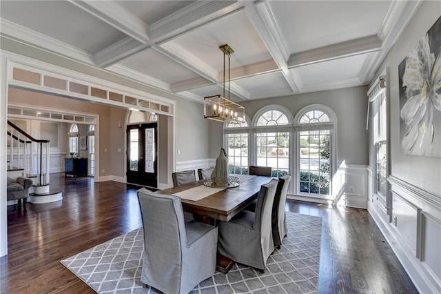 dining area with french doors, coffered ceiling, plenty of natural light, and beam ceiling