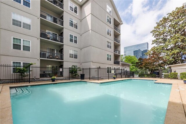 community pool featuring fence
