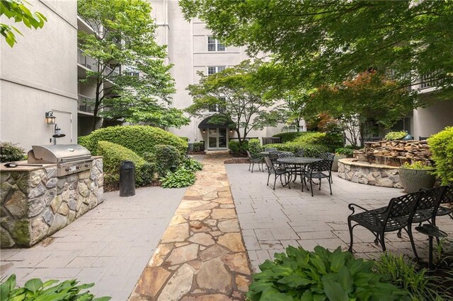 view of patio / terrace featuring outdoor dining space and area for grilling