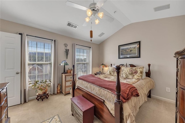 bedroom featuring visible vents, vaulted ceiling, and light carpet