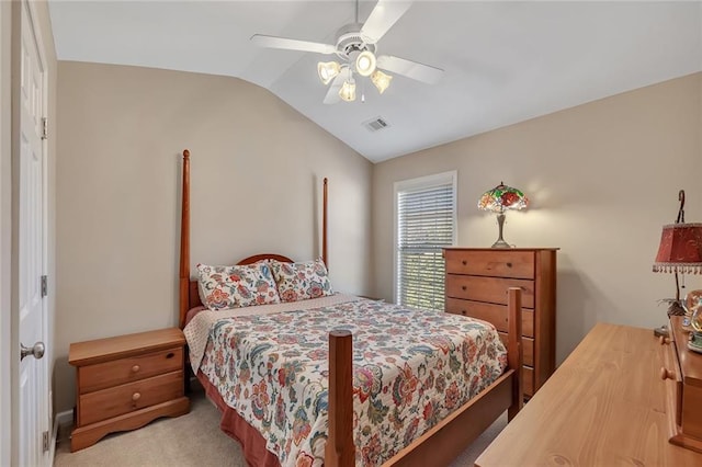 carpeted bedroom featuring ceiling fan, visible vents, and vaulted ceiling