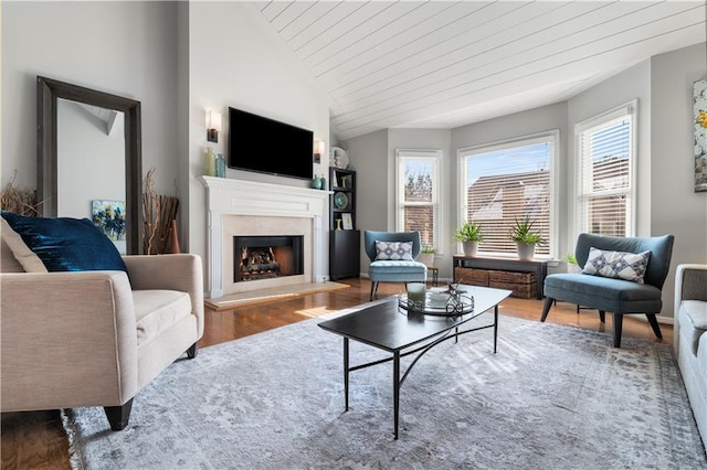 living room with wood ceiling, hardwood / wood-style floors, and lofted ceiling