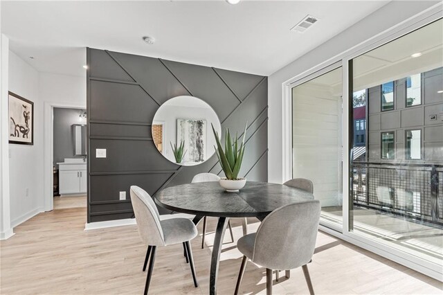 dining room with light hardwood / wood-style floors