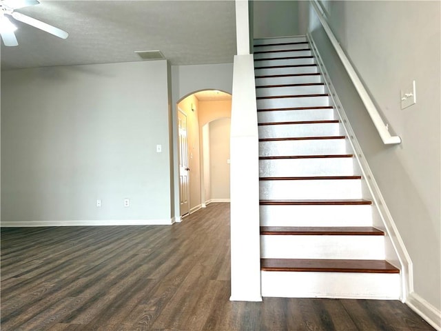 3884 Grovemont Pl, Duluth, GA 30096 - staircase with arched walkways, wood finished floors, and a ceiling fan