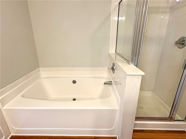 3884 Grovemont Pl, Duluth, GA 30096 - bathroom with a stall shower and a garden tub