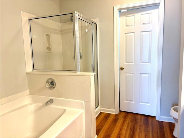 3884 Grovemont Pl, Duluth, GA 30096 - full bathroom featuring a garden tub, a shower stall, and wood finished floors