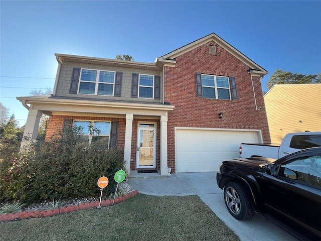 view of front of property with a garage