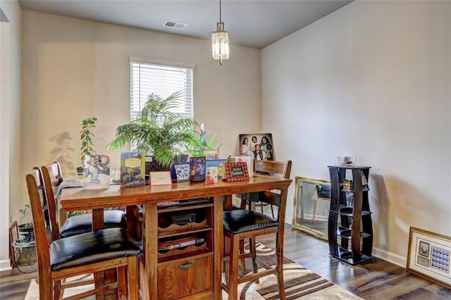 dining area featuring dark hardwood / wood-style flooring