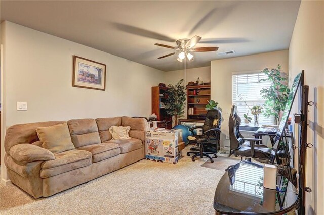 home office featuring carpet flooring and ceiling fan