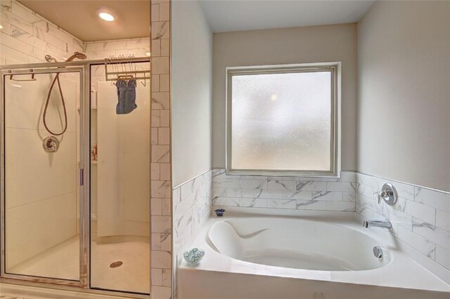 bathroom with independent shower and bath