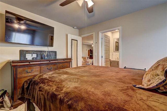 bedroom with carpet, ensuite bathroom, and ceiling fan