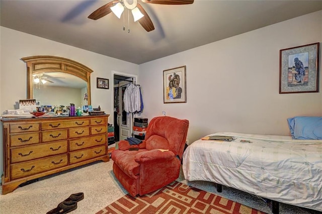 bedroom with carpet flooring, ceiling fan, and a closet