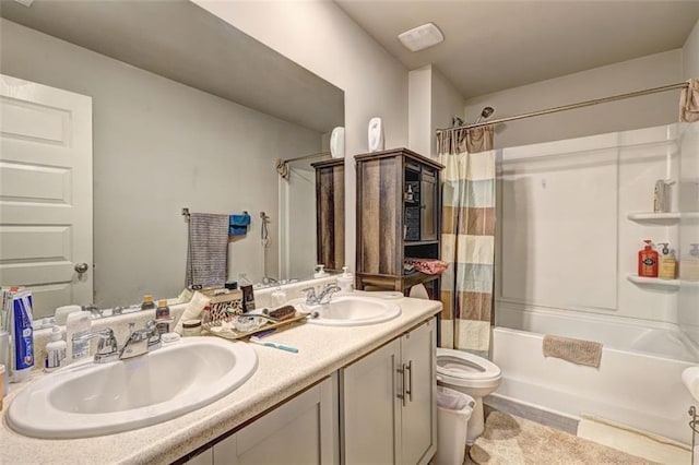 full bathroom featuring shower / tub combo, vanity, and toilet