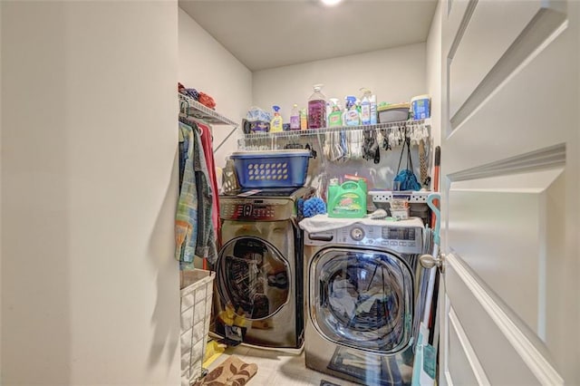 clothes washing area featuring washing machine and dryer