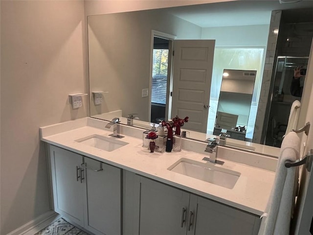 bathroom featuring vanity and a shower with door