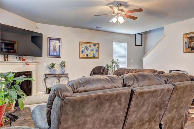 living room featuring hardwood / wood-style flooring and ceiling fan