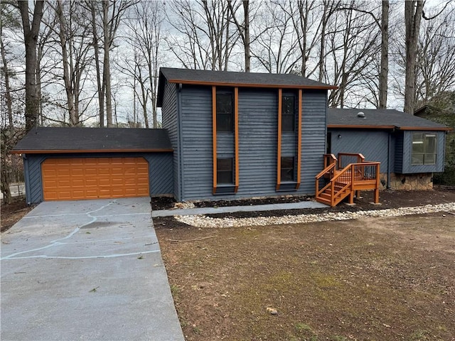 view of front of property featuring a garage and concrete driveway