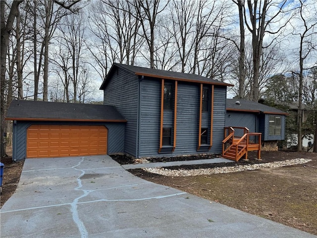 contemporary home with a garage and concrete driveway