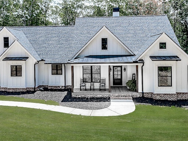 1170 Upper Sweetwater Trl SE, White, GA 30184 - view of front of property featuring metal roof, covered porch, a standing seam roof, and board and batten siding