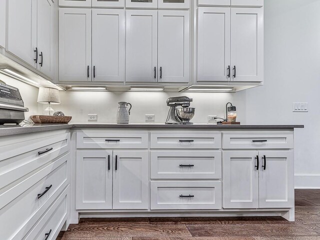 1170 Upper Sweetwater Trl SE, White, GA 30184 - kitchen with white cabinets and dark wood-style flooring