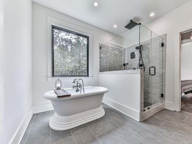 1170 Upper Sweetwater Trl SE, White, GA 30184 - full bath featuring a freestanding tub, baseboards, a stall shower, and recessed lighting
